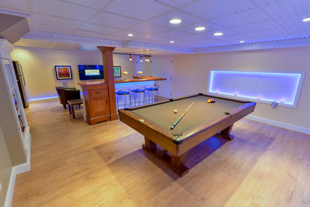 Finished basement game room with pool table and LED cove lighting