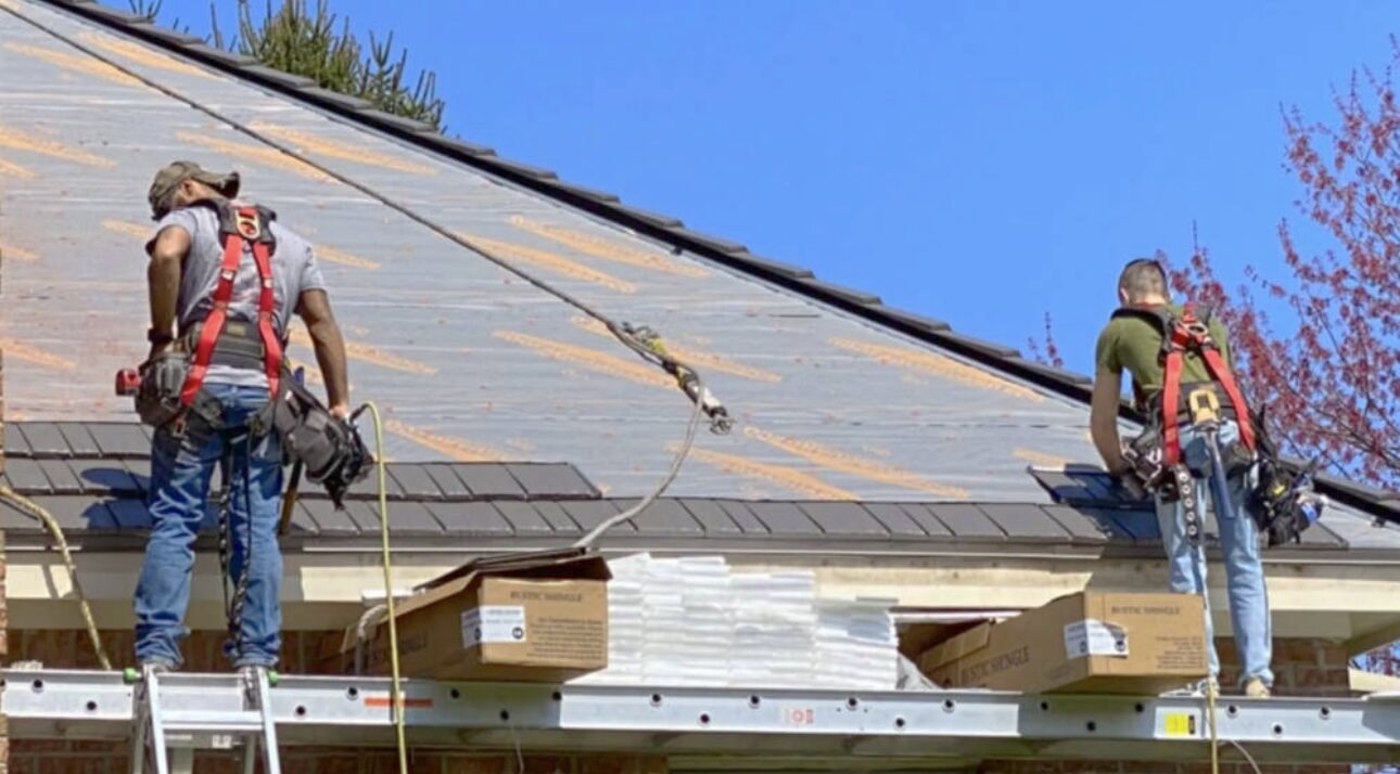 Roofing crew replacing a pitched roof in New Jersey